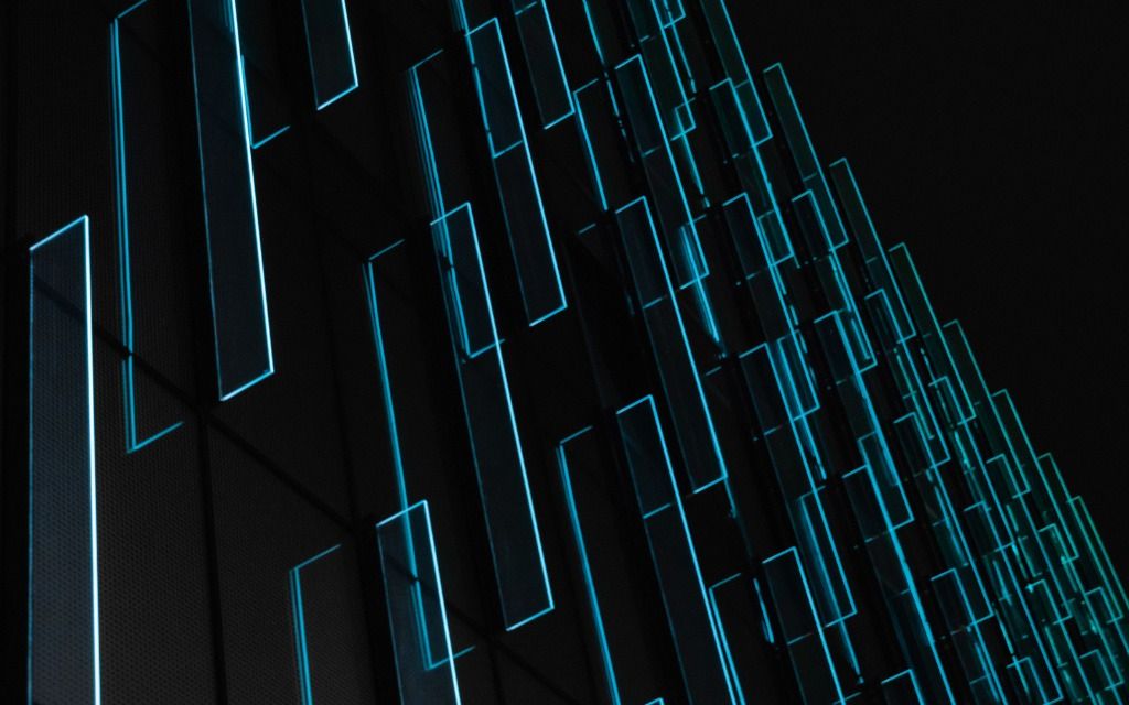 Abstract blue neon geometric wireframe pattern on black background - accounting services for digital designers and tech creatives