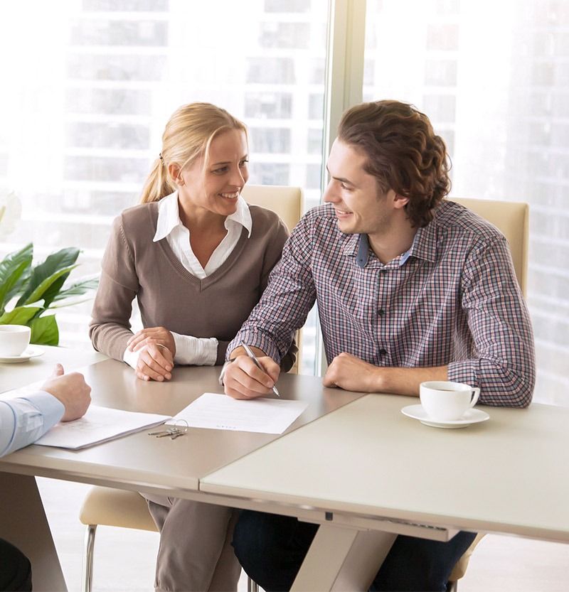 Professional woman and male client in consultation meeting at bright office table with documents - personal accounting consultation services for creative business owners